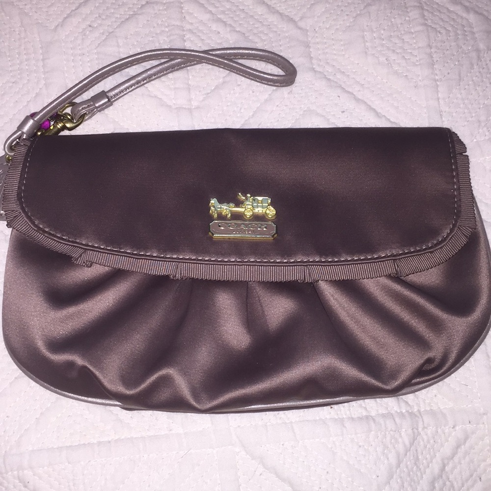Coach clutch - sand/tan color. Perfect condition.